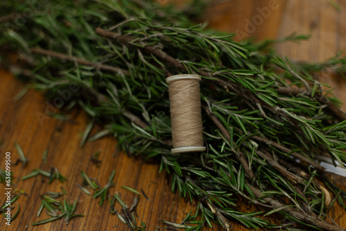 Rosemary herb stick making. Natural incense for home and meditation photo