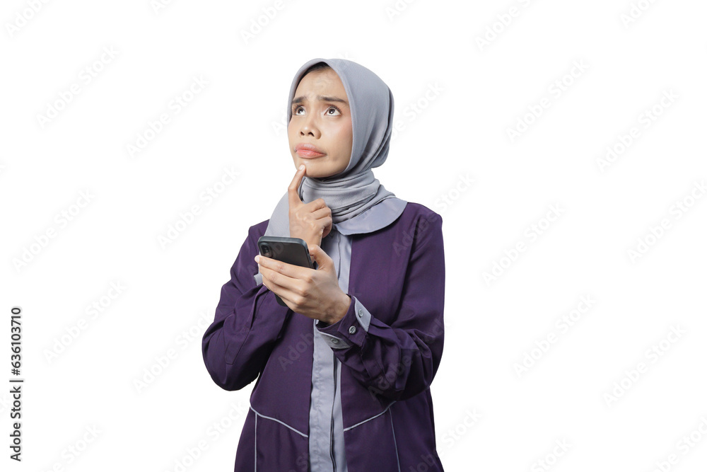 Cheerful beautiful Asian woman in casual shirt and hijab using a mobile phone Cheerful beautiful Asian woman in casual shirt and hijab using a mobile phone