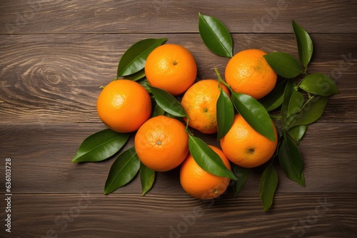 Tangerine citrus fruits on rustic wooden table top.