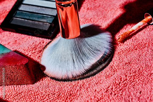 make-up sponge, brush and eyeshadow palette photo