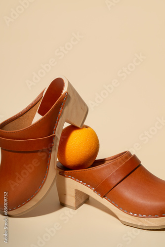 Clogs shoes on nude background