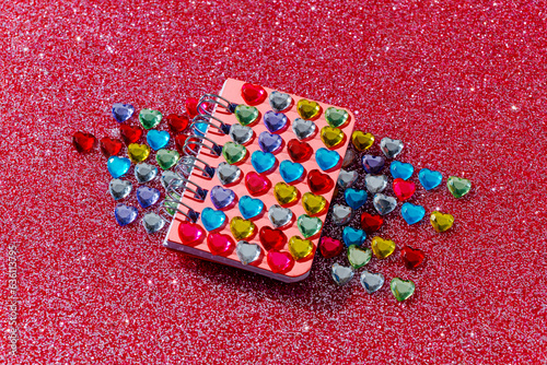 notebook covered with heart-shaped fake jewels