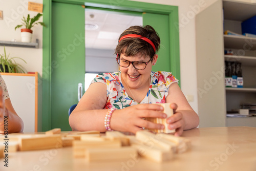 Woman with cognitive challenges triumphs through puzzles. photo