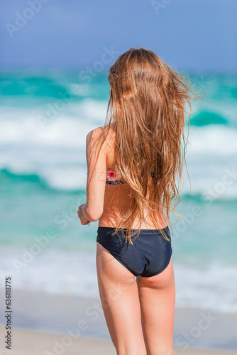 Happy young girl enjoy tropical beach vacation © travnikovstudio