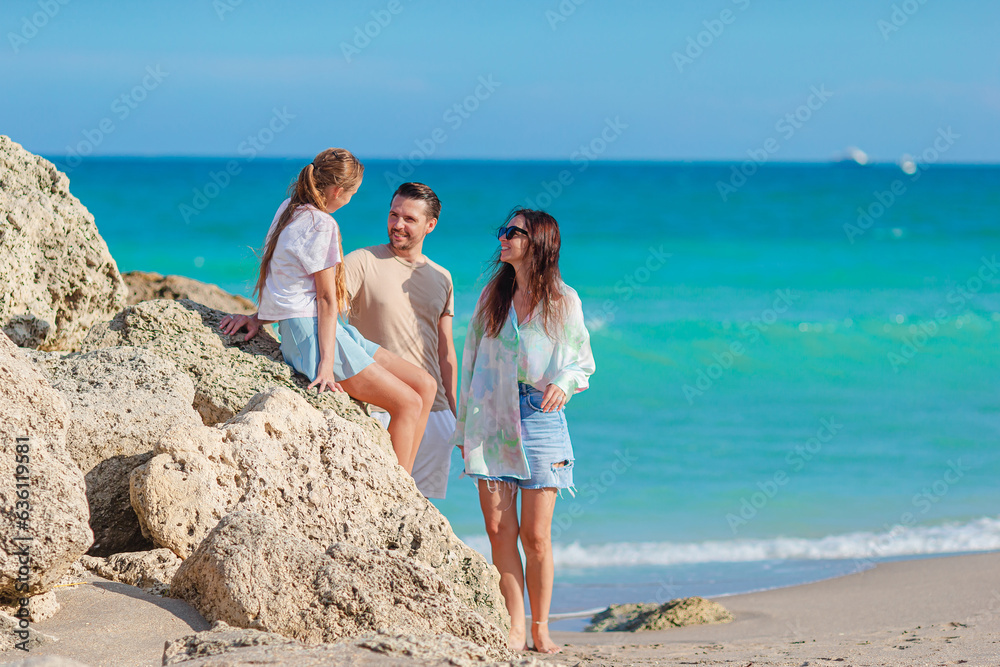 Happy family on the beach during summer vacation Happy family on the beach during summer vacation