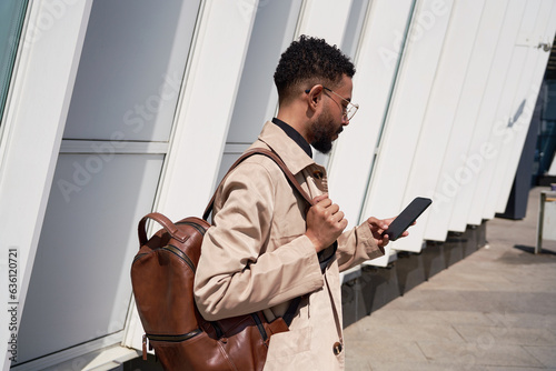 Young Student Using A Phone In The City photo