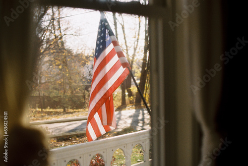flag of united states seen from the inside of a house photo
