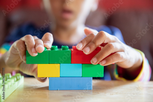 Closeup of blocks being assembled by a child