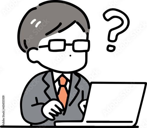 パソコンの前で考える眼鏡のビジネスマン