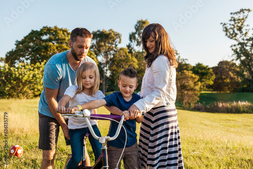 Young Family of 4 in a park photo