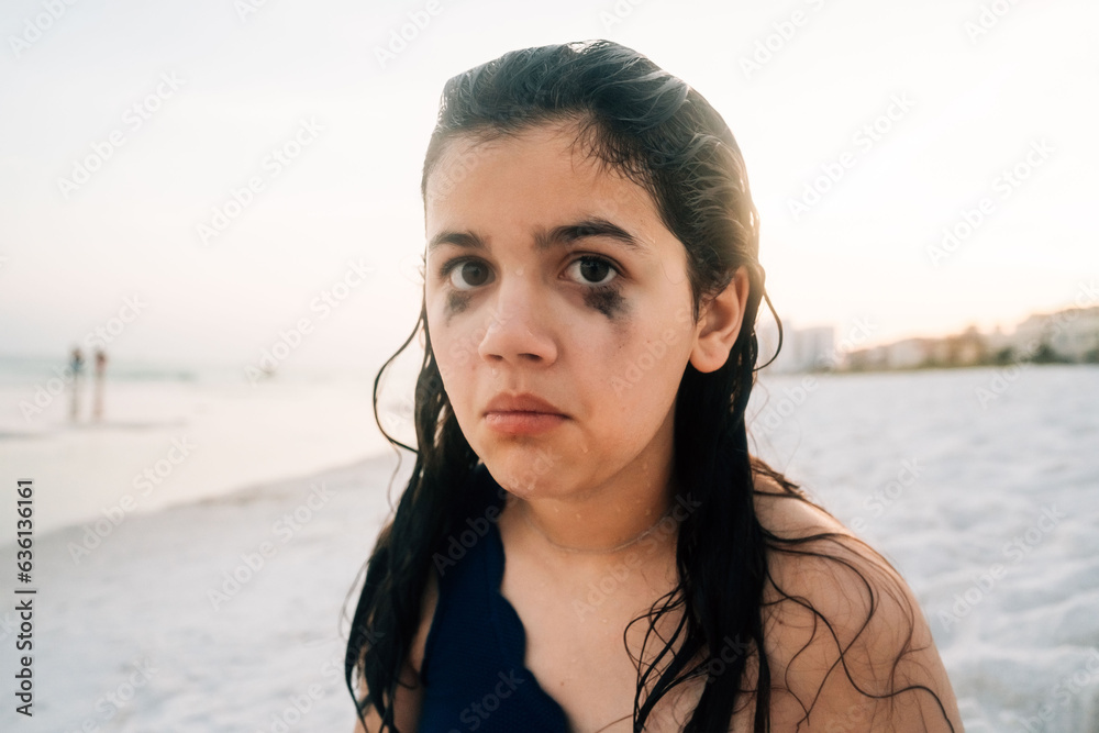 Preteen girl with mascara running down her face. Stock Photo Adobe Stock