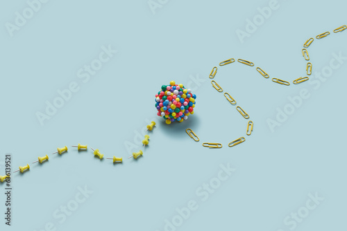 Cluster sphere on push pins and paper clips dotted line.