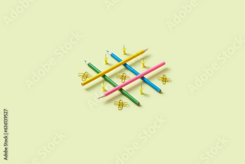 Stylish tic-tac-toe made of pencils and paper clips.