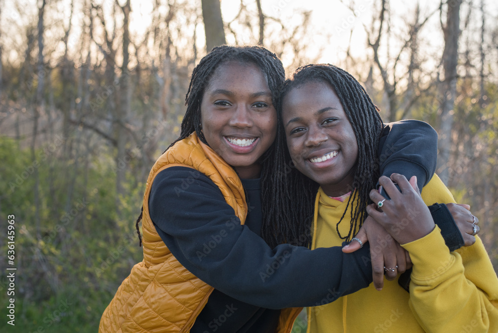 Smiling hugging sisters Smiling hugging sisters