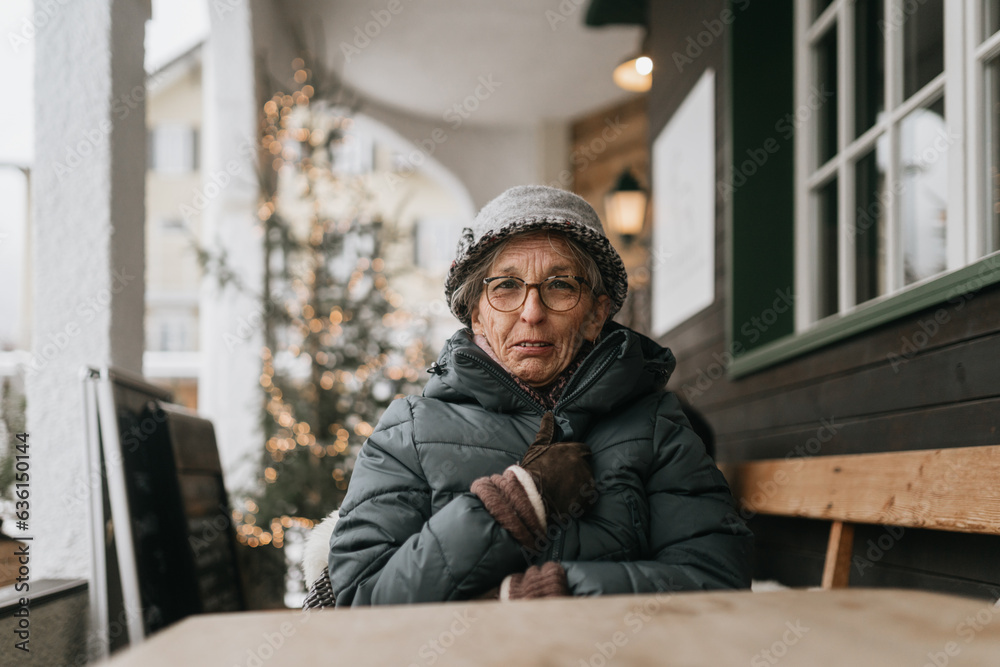 Cozy Woman Snuggled on Snowy Terrace Cozy Woman Snuggled on Snowy Terrace