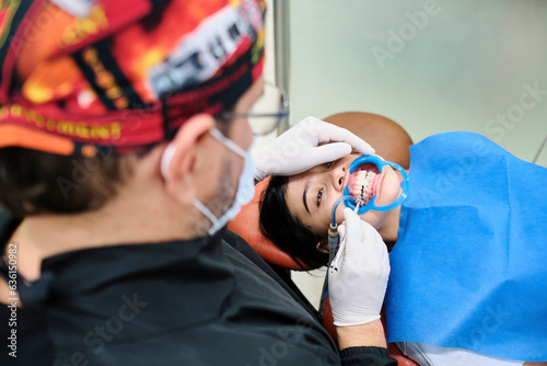 Patient receiving orthodontics treatment photo