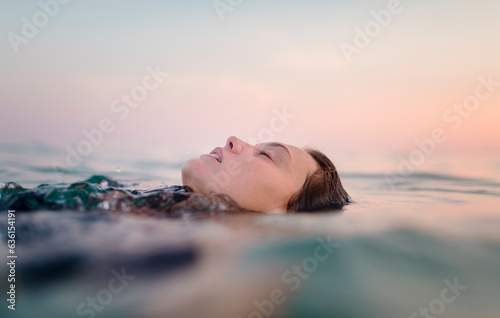 Peaceful moment floating in the water photo