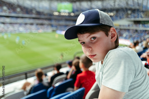 Boy spectator at sports stadium.