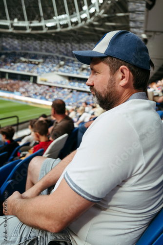 Male spectator at football match.