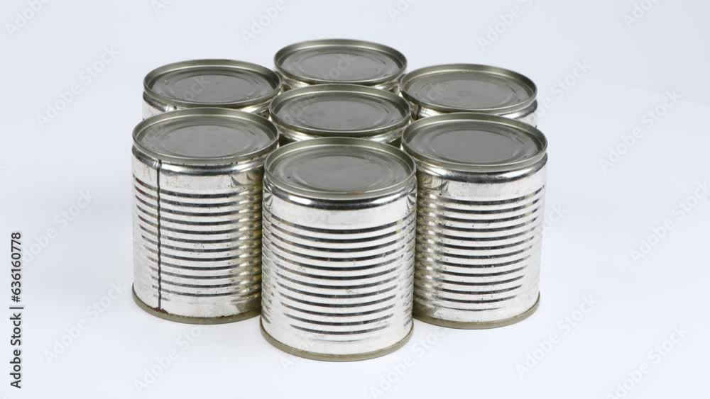 Seven metal cans on a white background. Side view. Loop motion. Rotation 360. 4K UHD video footage 3840X2160. Seven metal cans on a white background. Side view. Loop motion. Rotation 360. 4K UHD video footage 3840X2160.