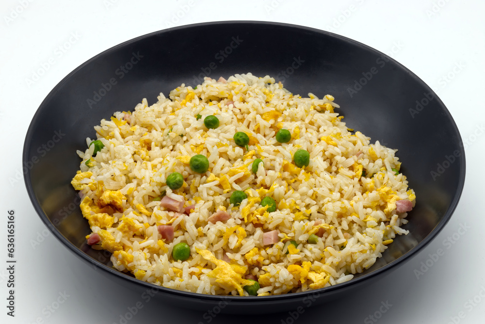 Cantonese Rice in a black dish isolated on white background. Cantonese Rice in a black dish isolated on white background.