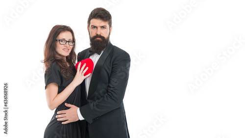 Feeling happiness. engagement. elegant couple formal event. love and romance. romantic date man and woman. happy valentines day. tuxedo man beard and girl in glasses. formal couple in love hold heart