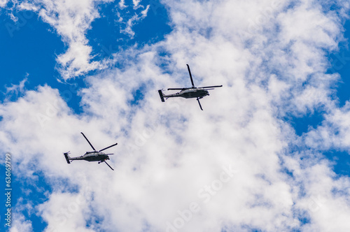 helicopter flying in the sky. two helicopter rotorcraft. police helicopter. heli copter flight. helicopter ride