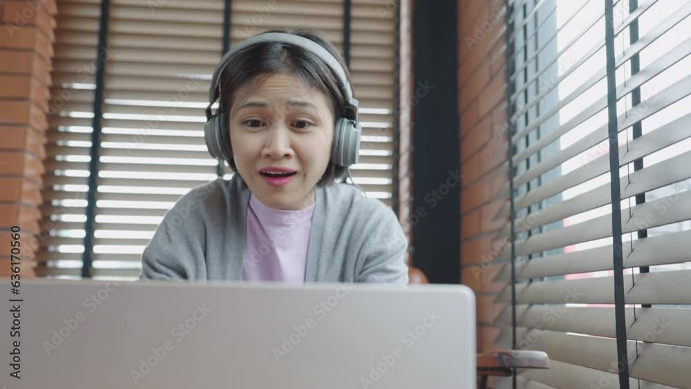 Young asian student woman using video conference call on laptop during remote online class, studying using laptop Young asian student woman using video conference call on laptop during remote online class, studying using laptop