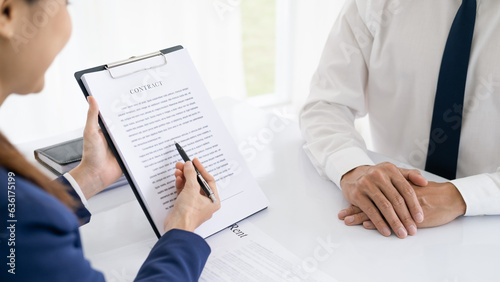 Attorneys or lawyers who are reading the statute of limitations Consultation between male lawyers and business clients, tax and legal and legal services firms.