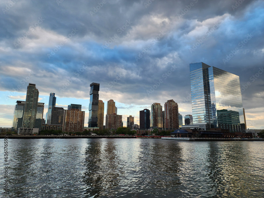 Obraz premium Jersey City, USA - May 05, 2023: cityscape view with skyscraper building architecture in skyline of jersey city