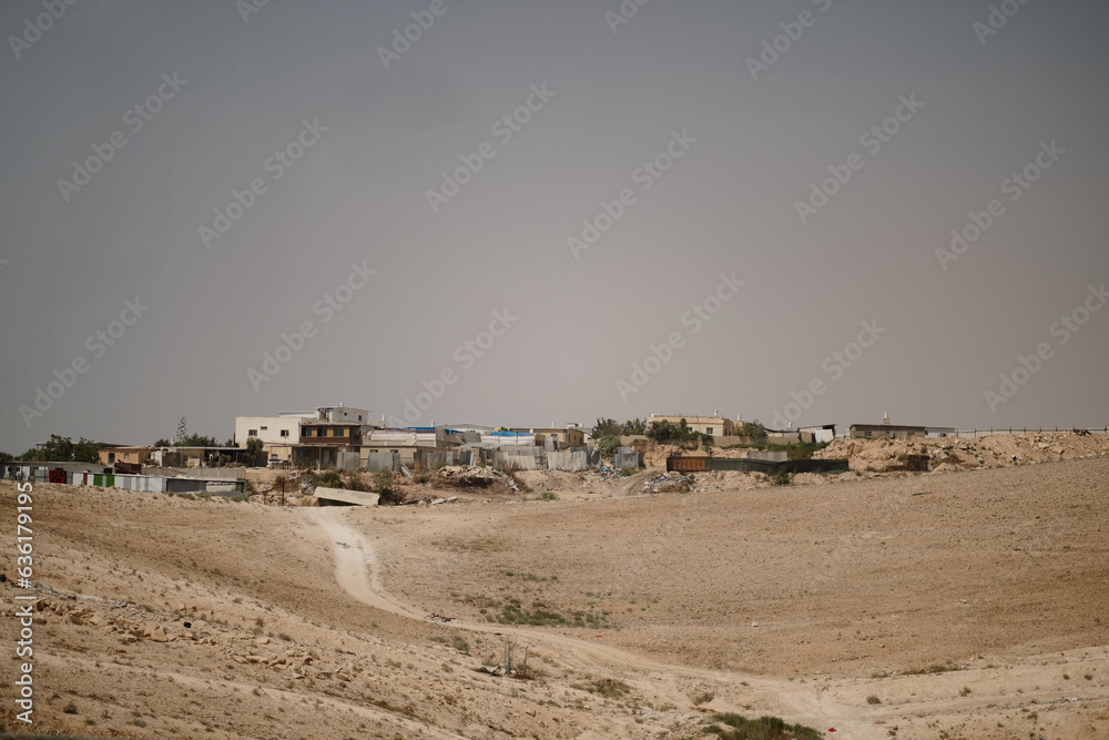 A dirt road leads to a remote Bedouin village in the Negev Desert of southern Israel.