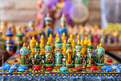 Photos Handmade wooden colorful chess in the form of Uzbek figures