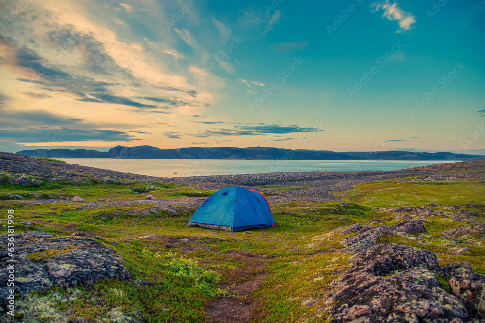 Tourist tent on the picturesque coast of the Barents Sea.