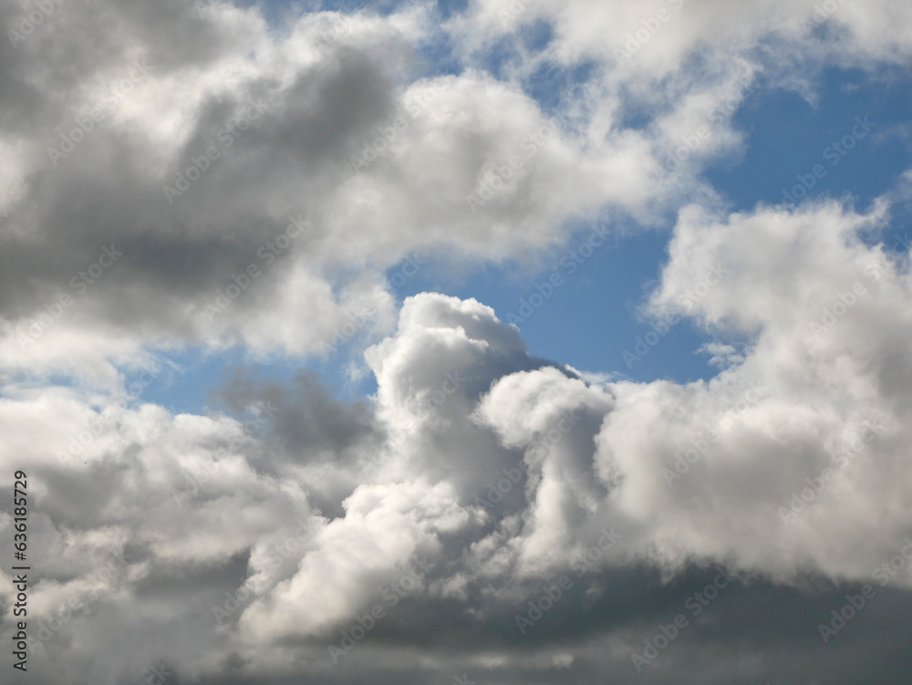 Obraz premium White clouds over blue sky background. Fluffy cumulus cloudscape