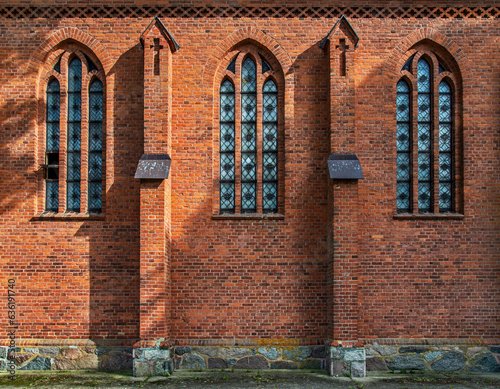Fototapeta Naklejka Na Ścianę i Meble -  General view and close-up architectural details of the Catholic Church of St. Holy Trinity in the town of Dwawrzuty in Masuria in Poland.
