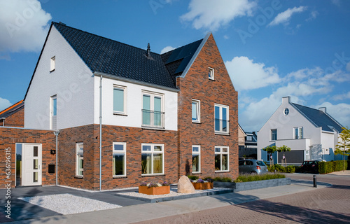 Wallpaper Mural Dutch Suburban area with modern family houses, newly built modern family homes in the Netherlands, dutch family house in the Netherlands, Row of modern houses in contemporary neighborhood  Torontodigital.ca