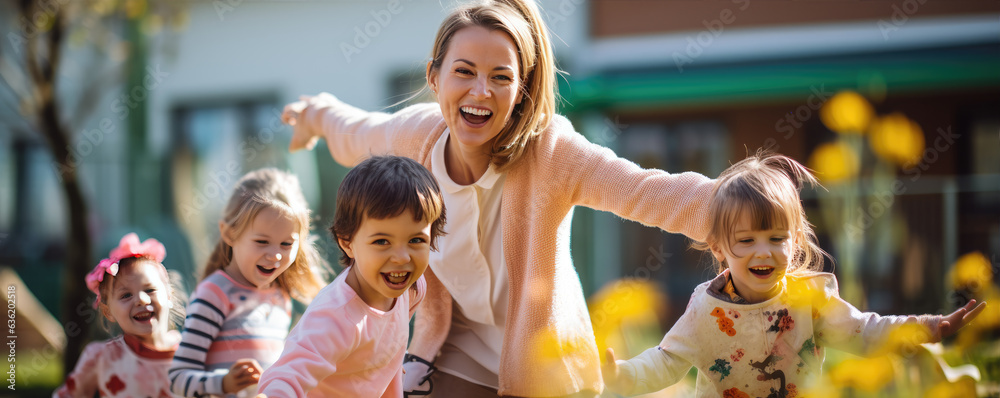 Beautiful young mother is playing with happy kids outside.