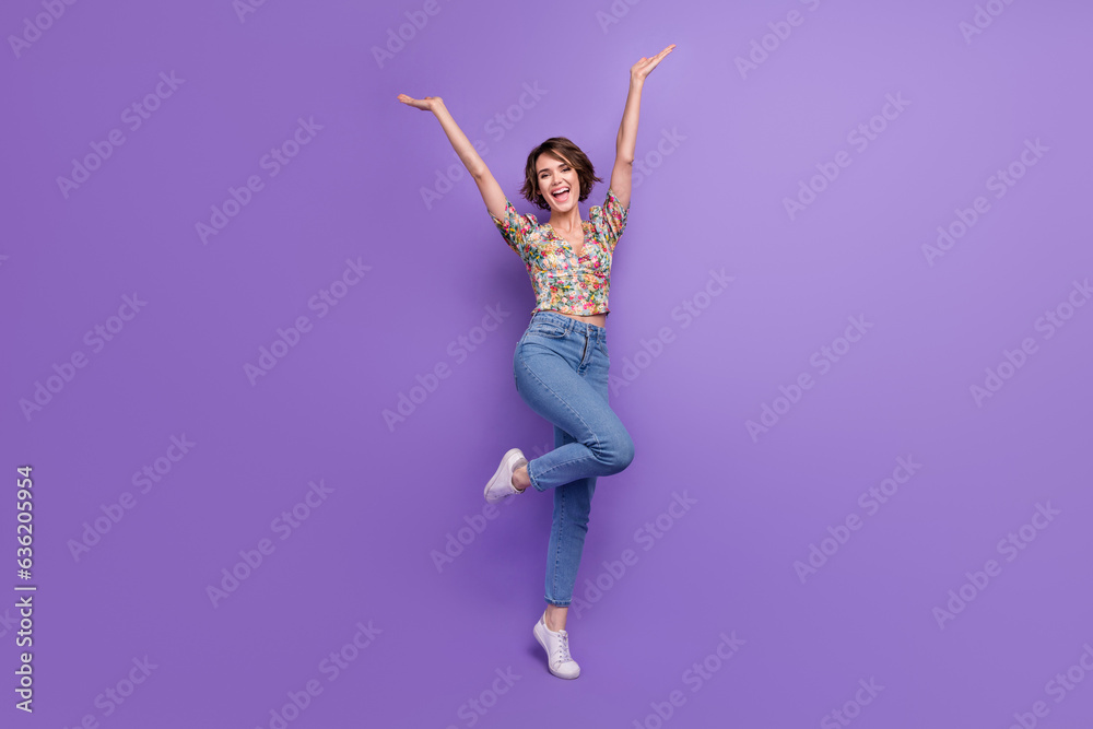 Full length portrait of stunning satisfied person raise hands rejoice dance isolated on purple color background