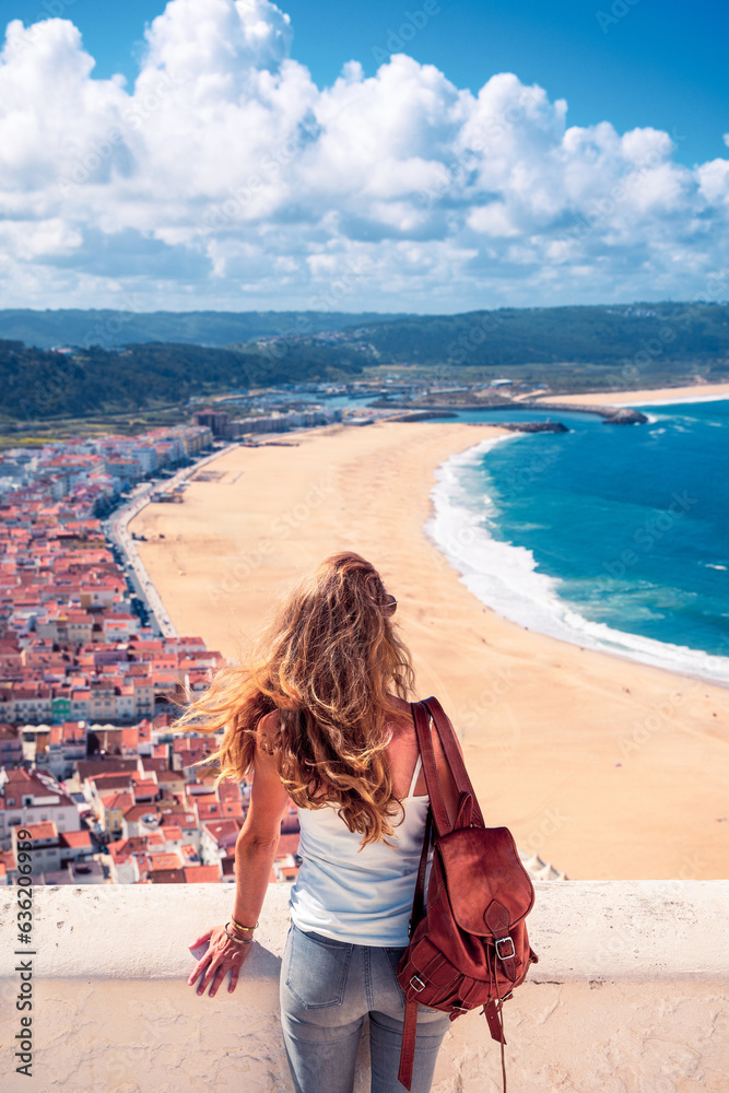 Woman in Portugal,  beautiful beach in Nazare