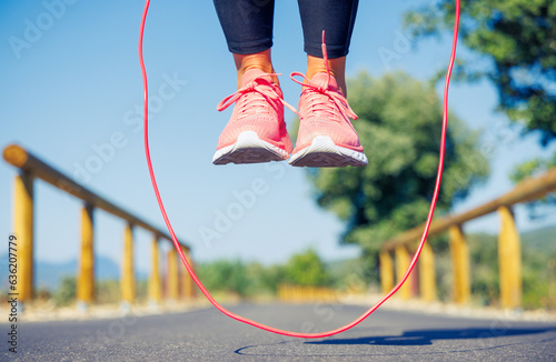 closeup on woman exercising with skipping rope
