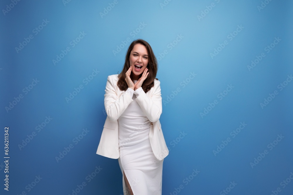 portrait of a pretty brunette business young woman in a white elegant dress and jacket portrait of a pretty brunette business young woman in a white elegant dress and jacket