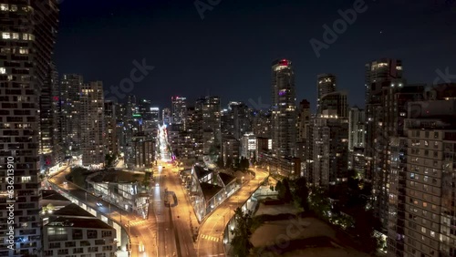 Aerial view of Downtown Vancouver, BC, at night, Granville Street Bridge, city hyper lapse, busy city street, high rise buildings, corporate office, city at night. 4K 24FPS PRORES 422 photo