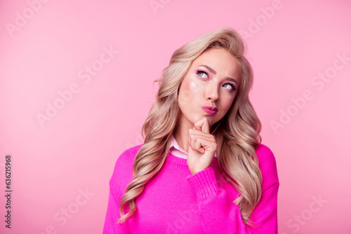 Photo of charming suspicious lady wear sweater arm chin looking empty space isolated pink color background