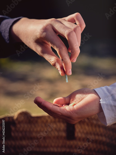 Crop person putting piece of plastic into hand of boy © ADDICTIVE STOCK CORE