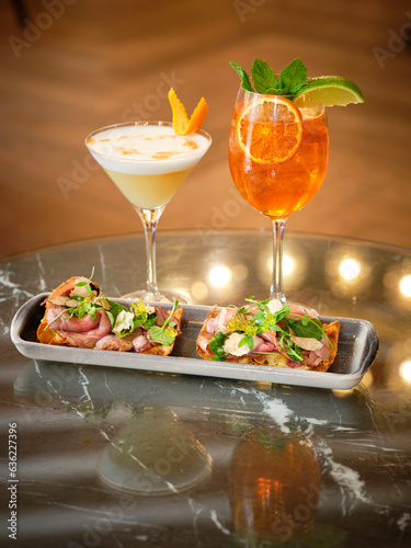 Fototapeta Naklejka Na Ścianę i Meble -  Few exotic cocktails and bruschettas