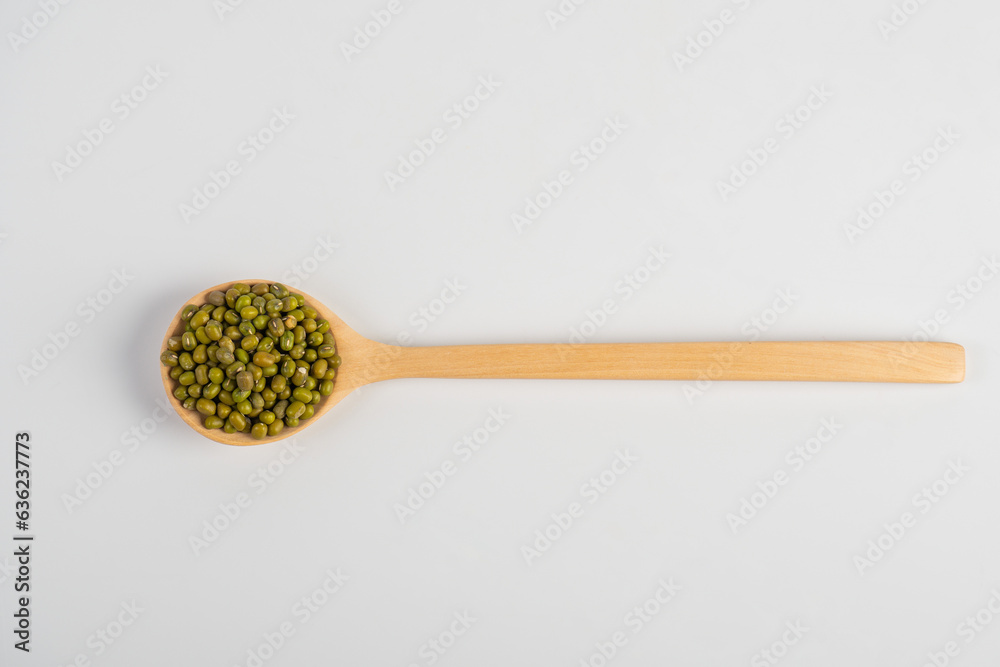 Mung beans isolated on spoon wooden on white background Mung beans isolated on spoon wooden on white background