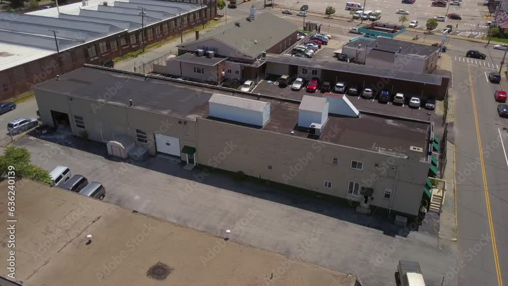 Aerial Shot Of Industrial Buildings In City On Sunny Day, Drone Flying Over Rooftop - Boston, Massachusetts Aerial Shot Of Industrial Buildings In City On Sunny Day, Drone Flying Over Rooftop - Boston, Massachusetts