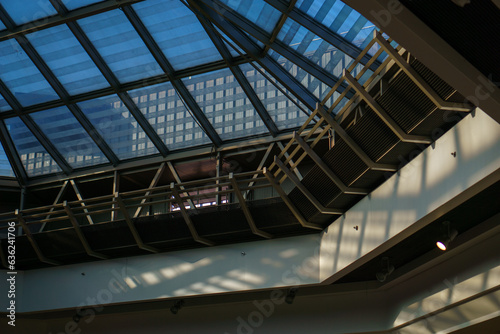 Pinacle of steel and glass that make the roof of a shopping mall, seen from the interior of the building