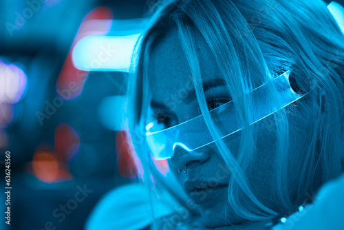 Portrait of a blonde in neon glasses.