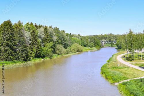 Countryside landscape with river in early summer